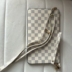 Brand new wristlet/clutch. Checkered pattern. Beautiful!